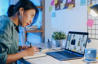 asia-businesswoman-using-laptop-talk-colleagues-about-plan-video-call-meeting-living-room